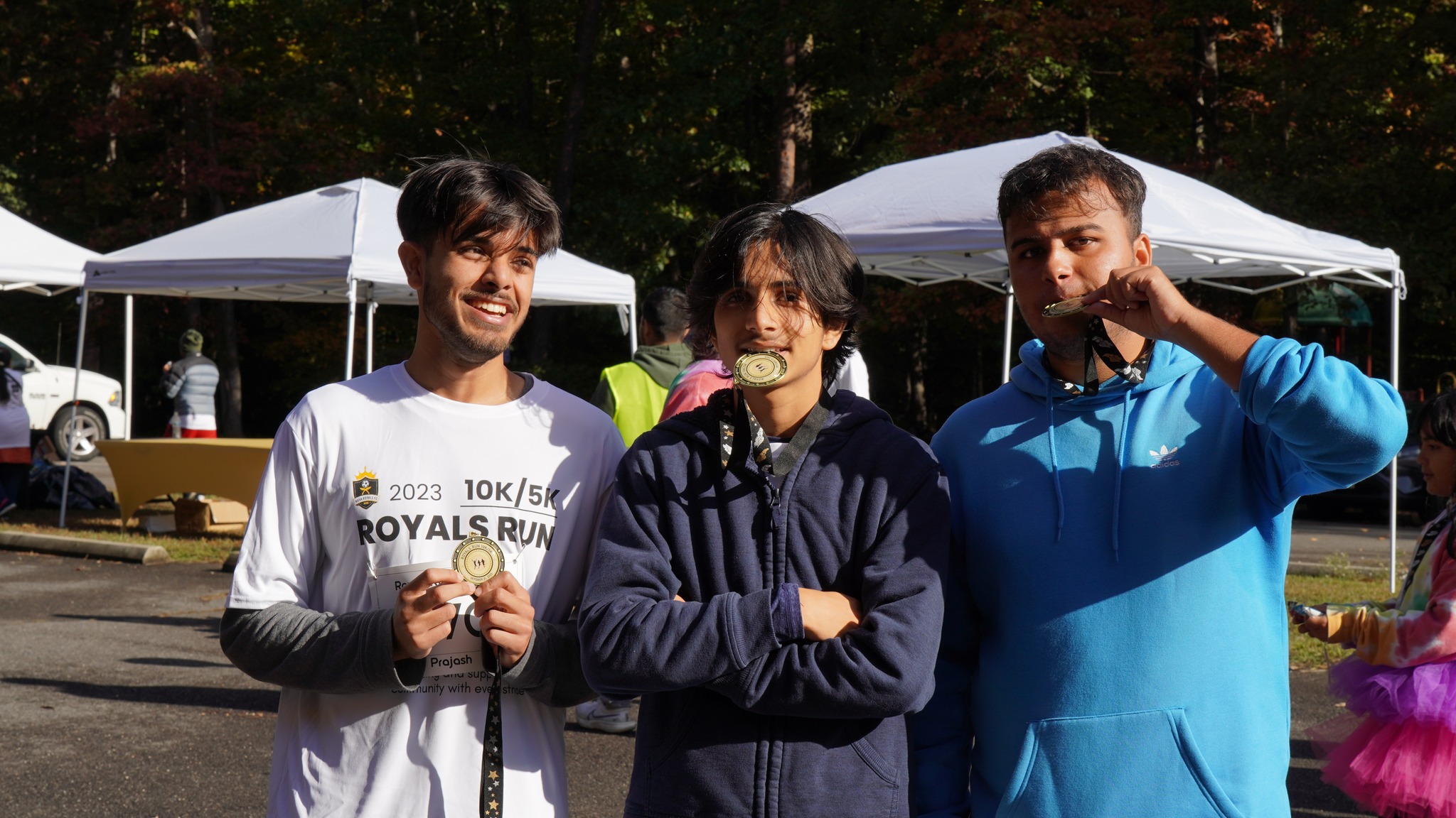 Royals Run finishers celebrating with their medals