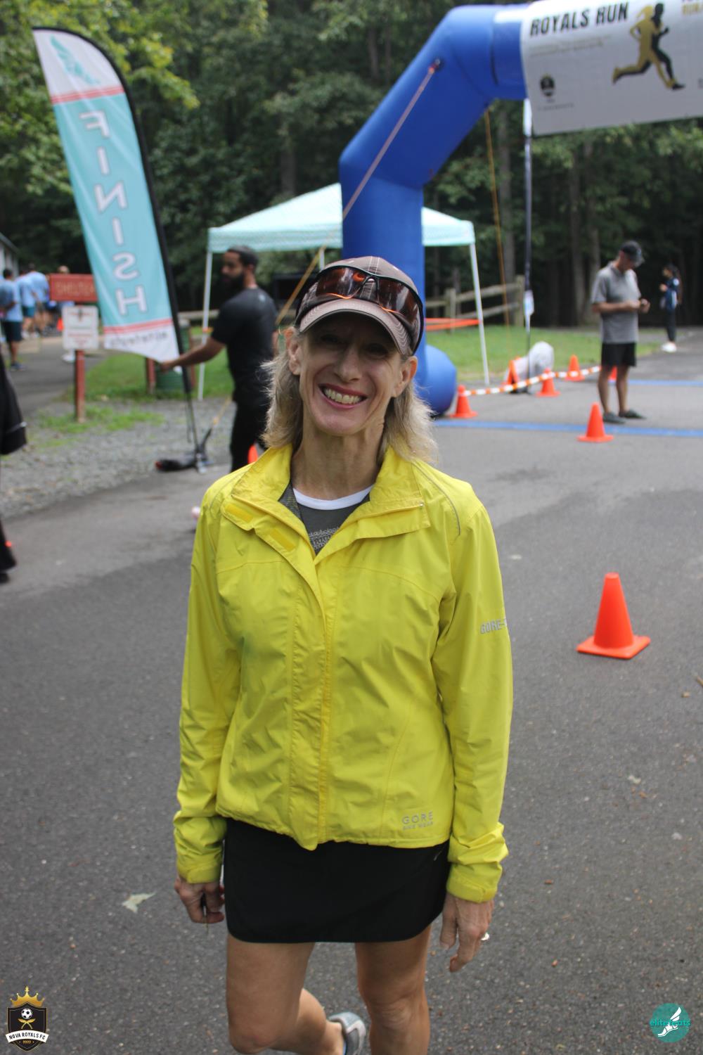 Royals Run volunteer smiling along the course